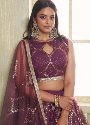 Party wear Trendy Wine colored net Lehenga with sequin embroidered blouse.